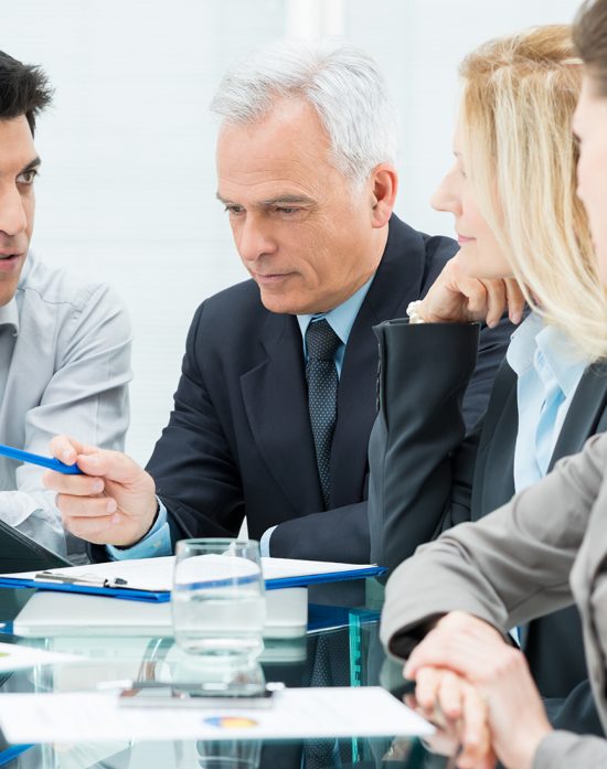 Group Of Coworkers Discussing In Conference Room